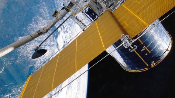 Satellite being put in orbit above Earth
